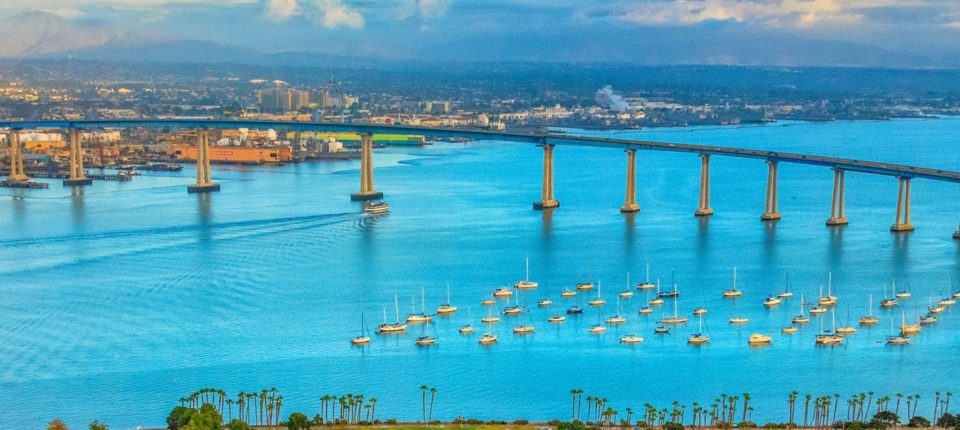 Aerial view of San Diego Bay with boats and Coronado Bridge