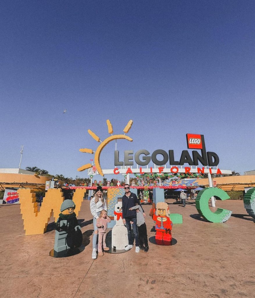 Family Standing in front of LEGOLAND sign